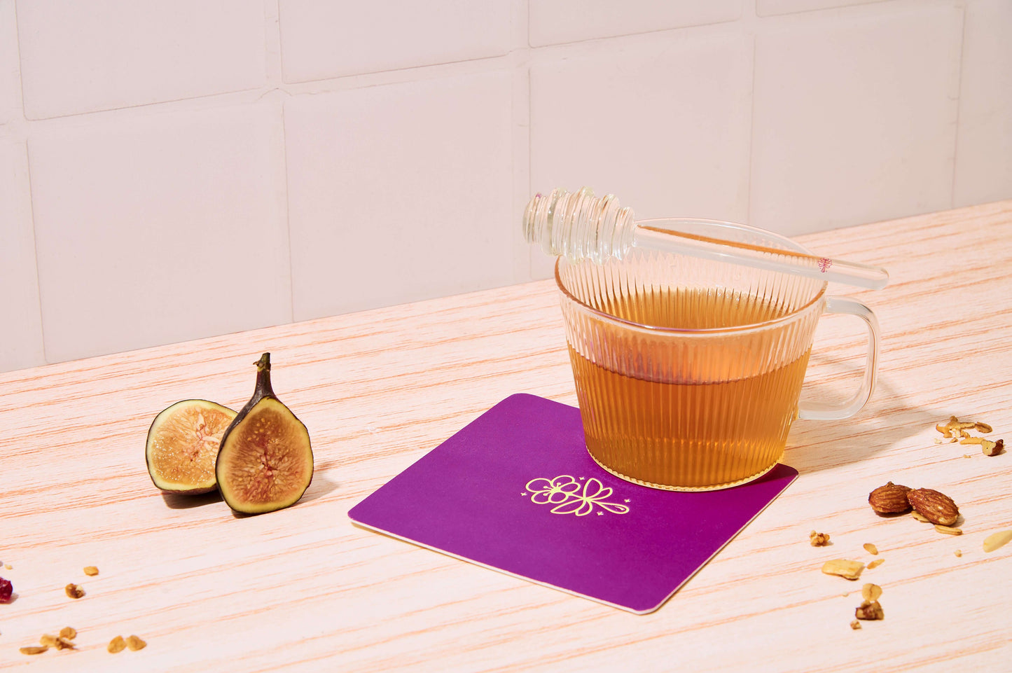 the drizzler | RARE Essentials featuring Mānuka honey in stylish glass, perfect for drizzling over favorite foods.